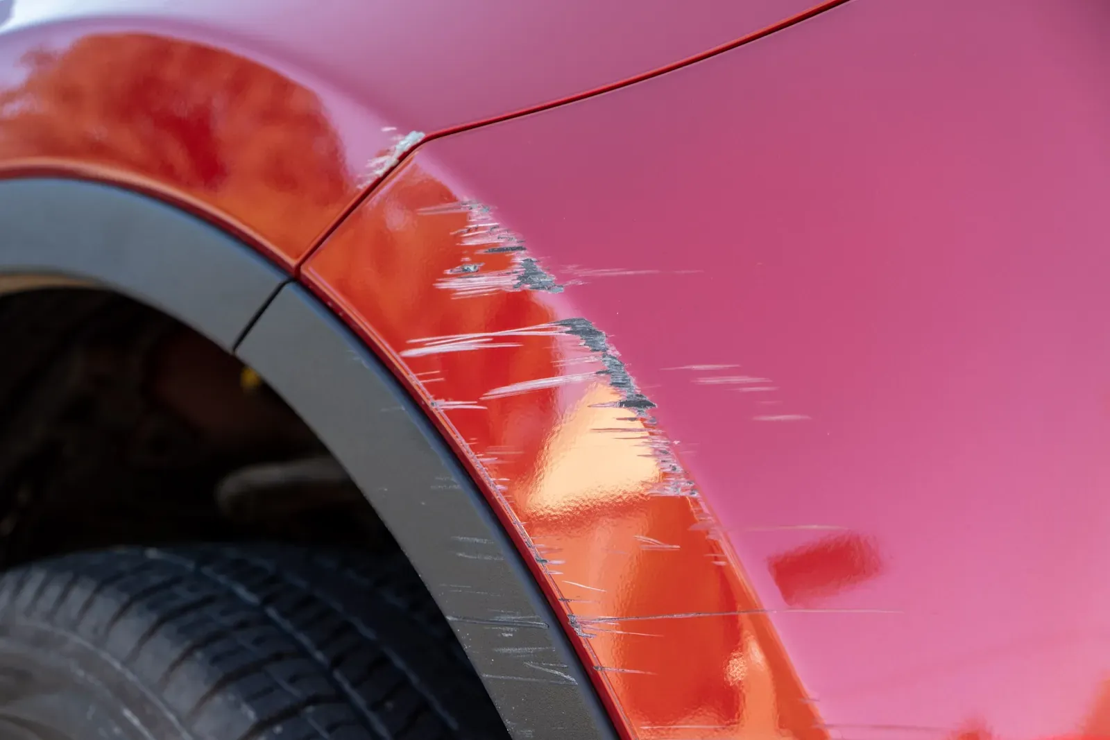 Scuffed bumper corner on a Georgetown vehicle before repair at Collision Auto Center