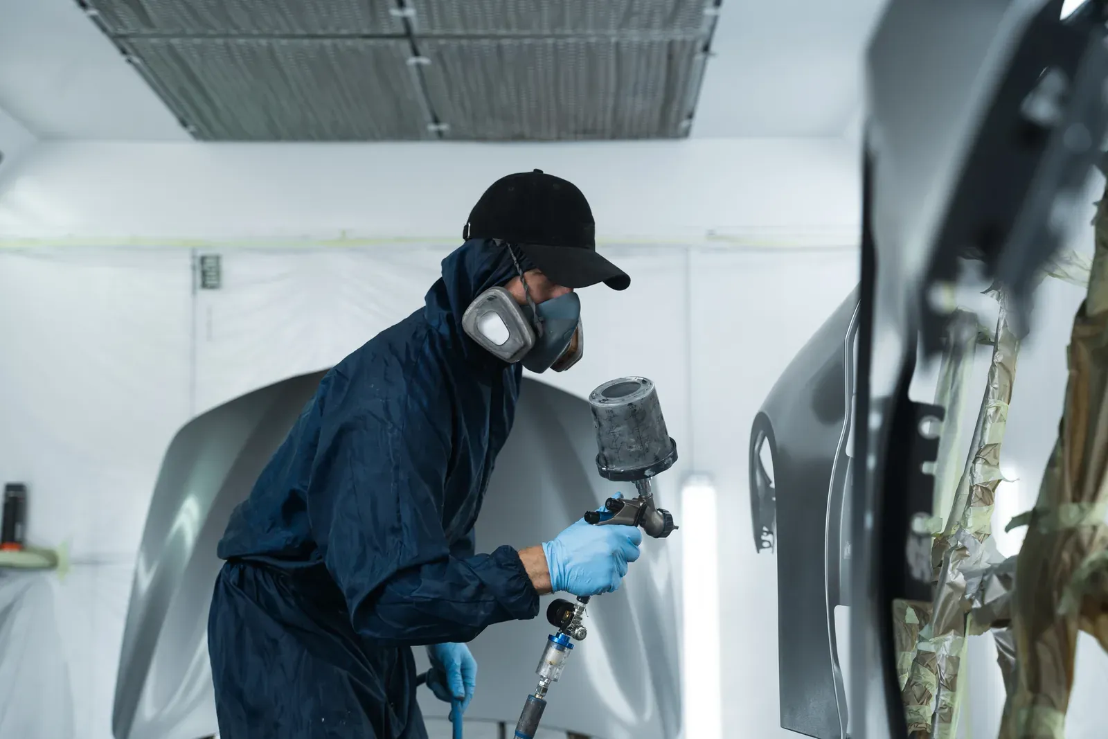 Panel from a Rexdale vehicle being refinished in the spray booth at Collision Auto Center